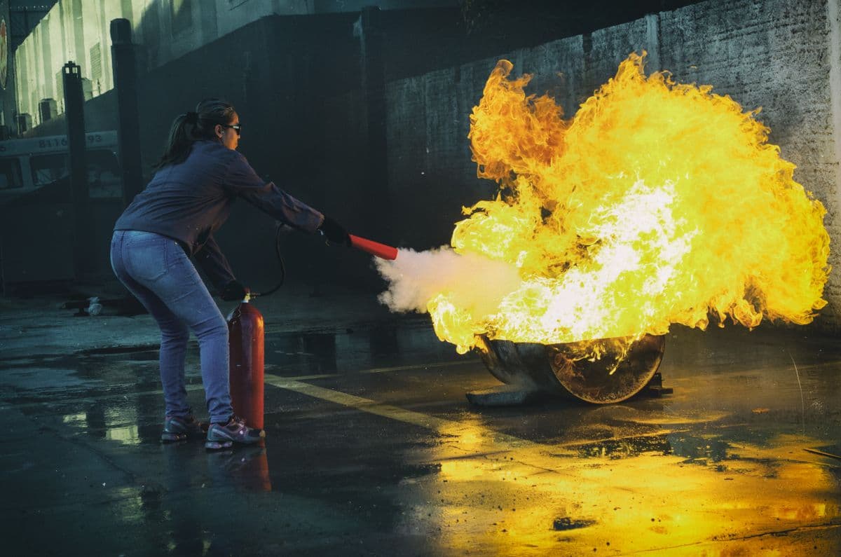 Demonstrating safe fire extinguisher use